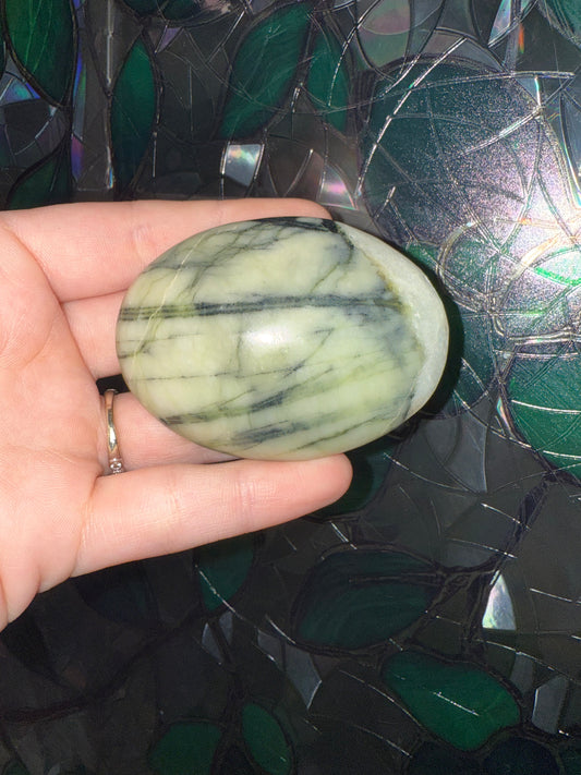 Serpentine palm stone